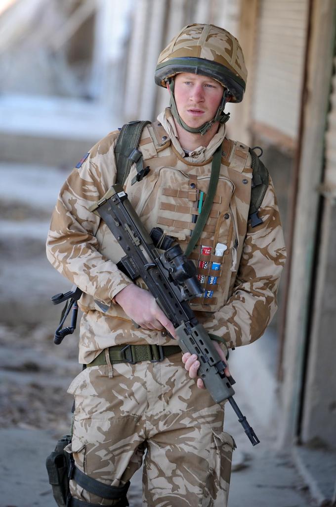 Prince Harry with a gun on patrol in Afghanistan.