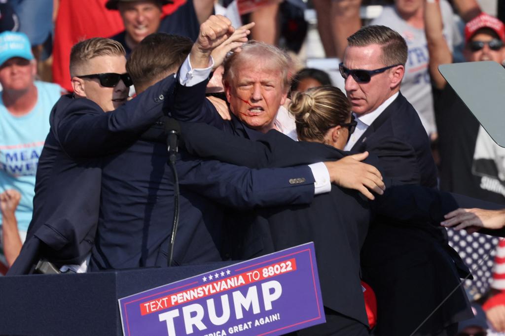 Donald Trump bleeding after he was shot at a Pennsylvania rally