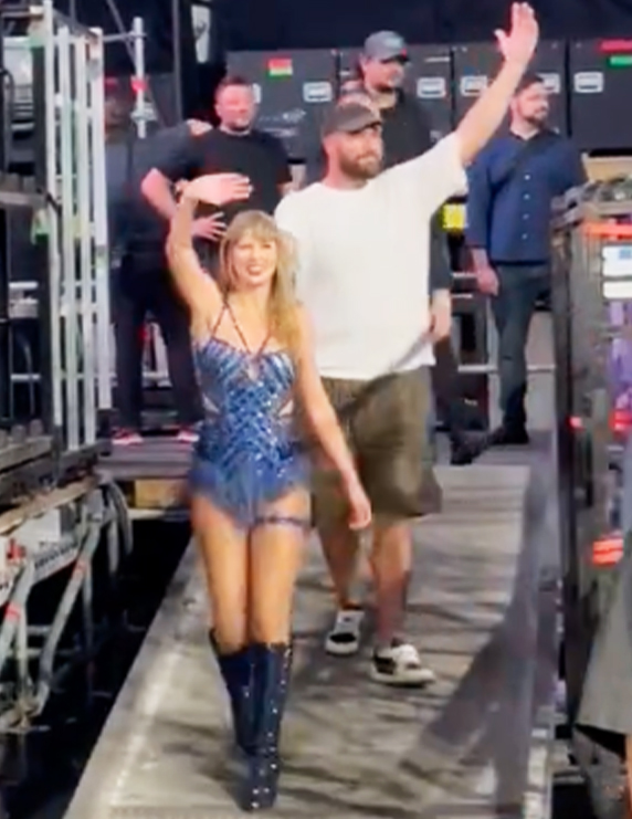 Travis Kelce walking with Taylor Swift after her third Amsterdam Eras Tour show