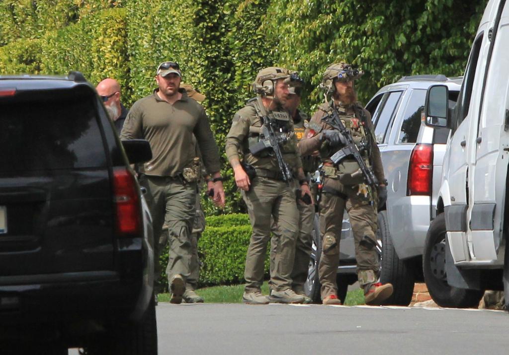 Officers outside Sean Combs' Los Angeles home.