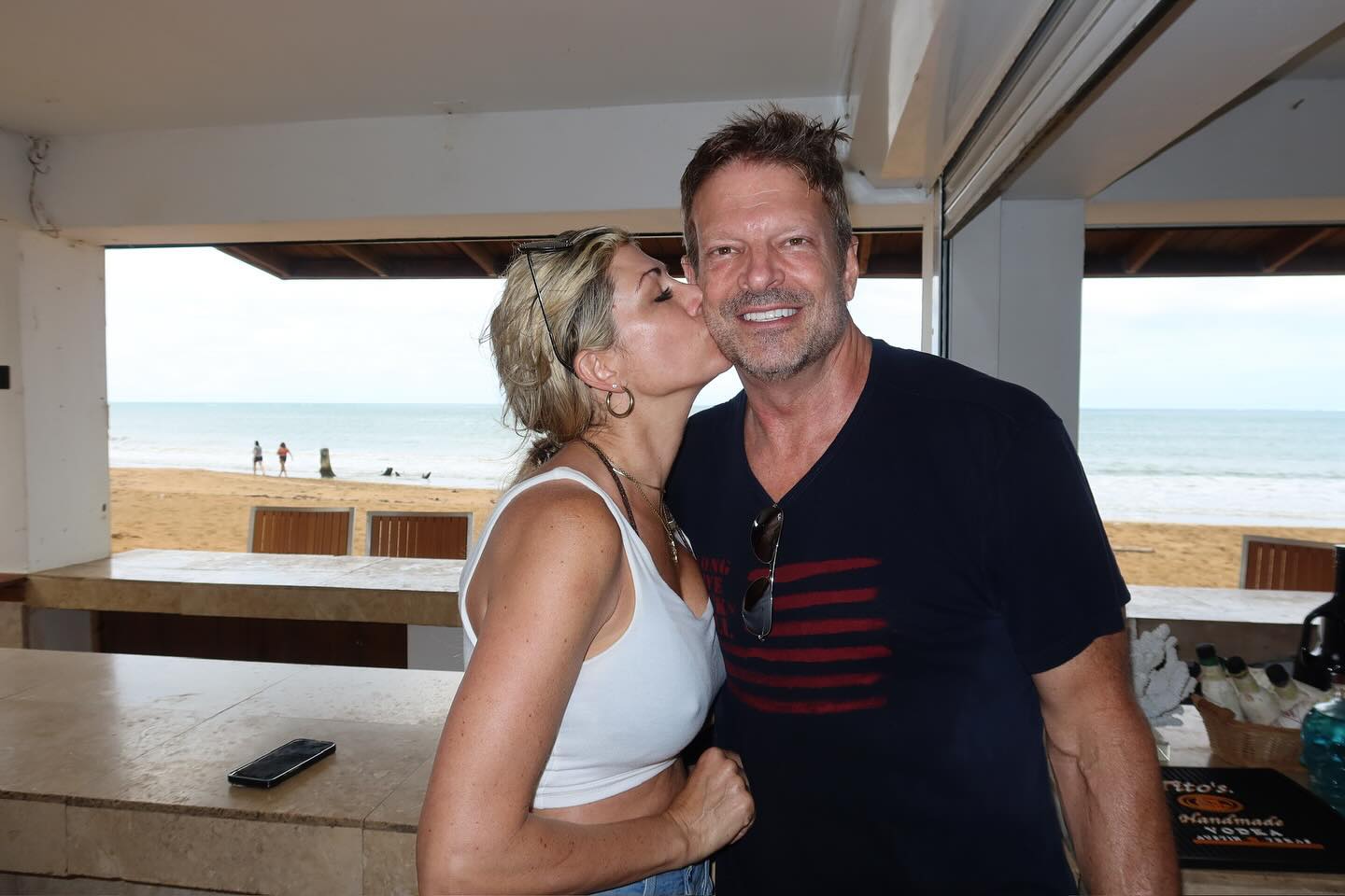 Alexis Bellino kissing John Janssen 