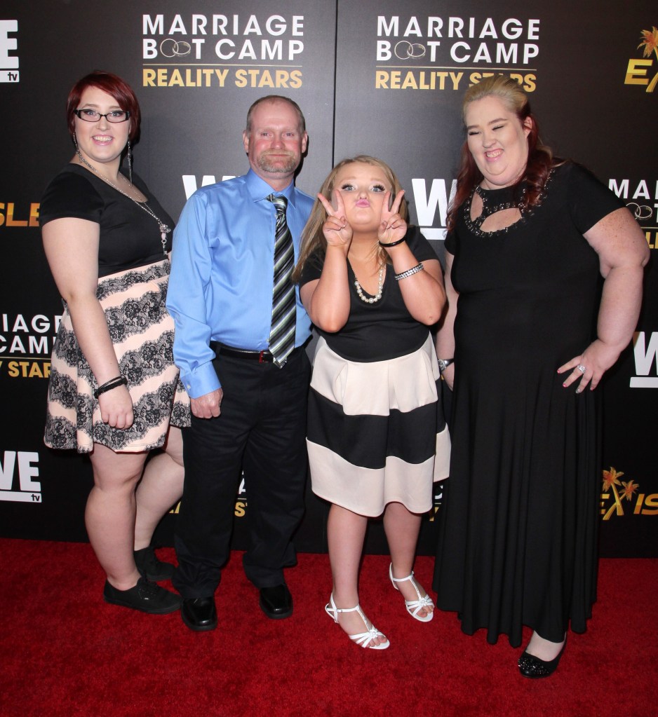 Lauryn "Pumpkin" Efird, Mike "Sugar Bear" Thompson, Alana "Honey Boo Boo" Thompson and "Mama June" Shannon on a red carpet.