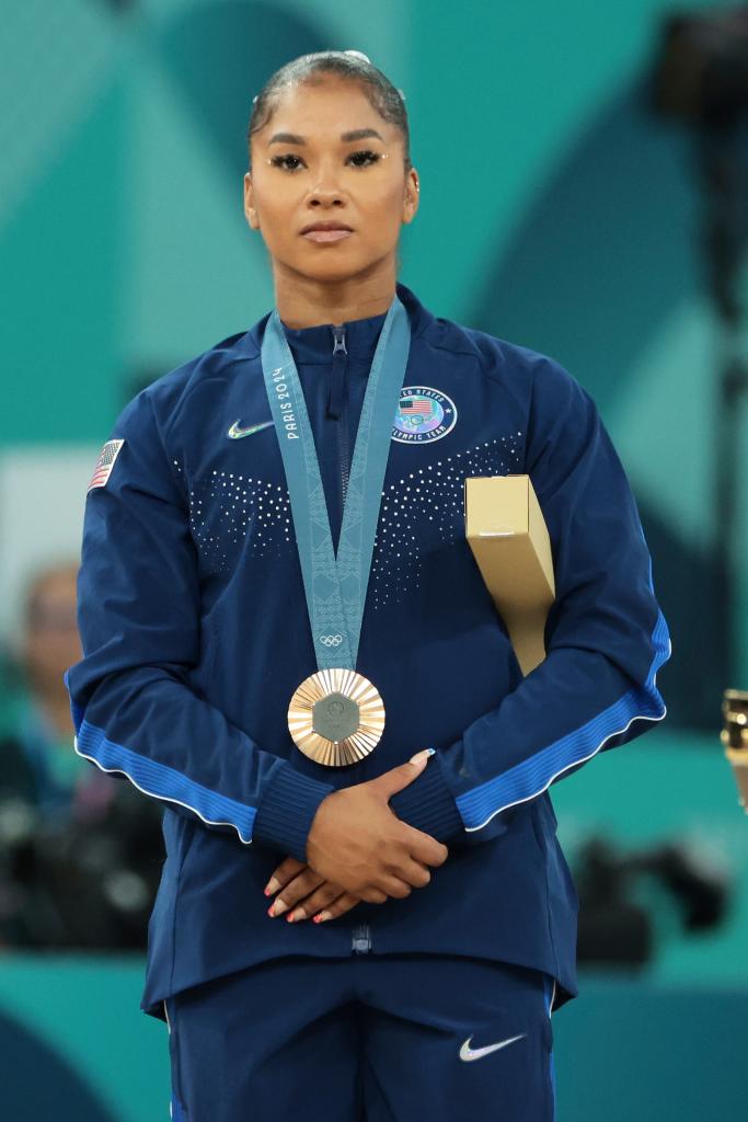 Bronze medalist Jordan Chiles (R) of Team United States poses on the podium at the Artistic Gymnastics Women's Floor Exercise Medal Ceremony on day ten of the Olympic Games Paris 2024 at Bercy Arena on August 05, 2024.