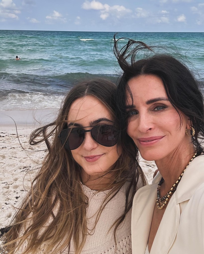 Coco Arquette and Courteney Cox on the beach