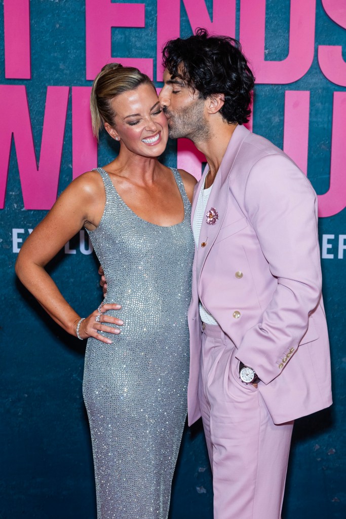 Justin Baldoni kisses his wife Emily Baldoni.