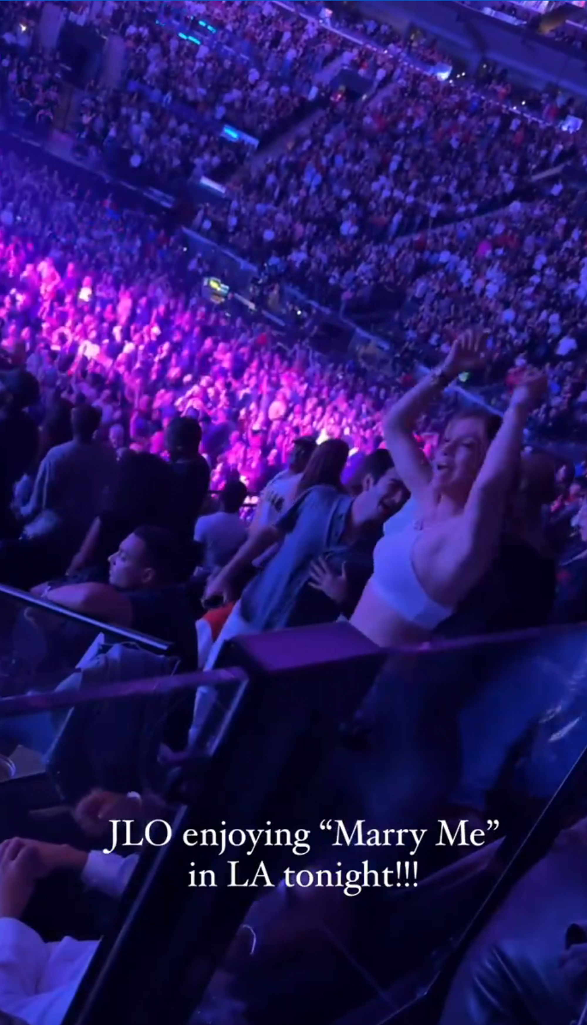 Jennifer Lopez dancing at a concert