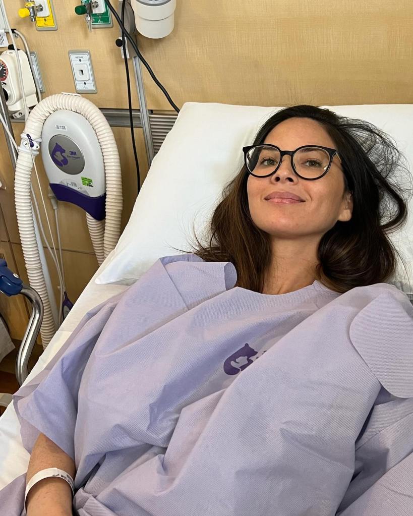 olivia munn lying in a hospital bed