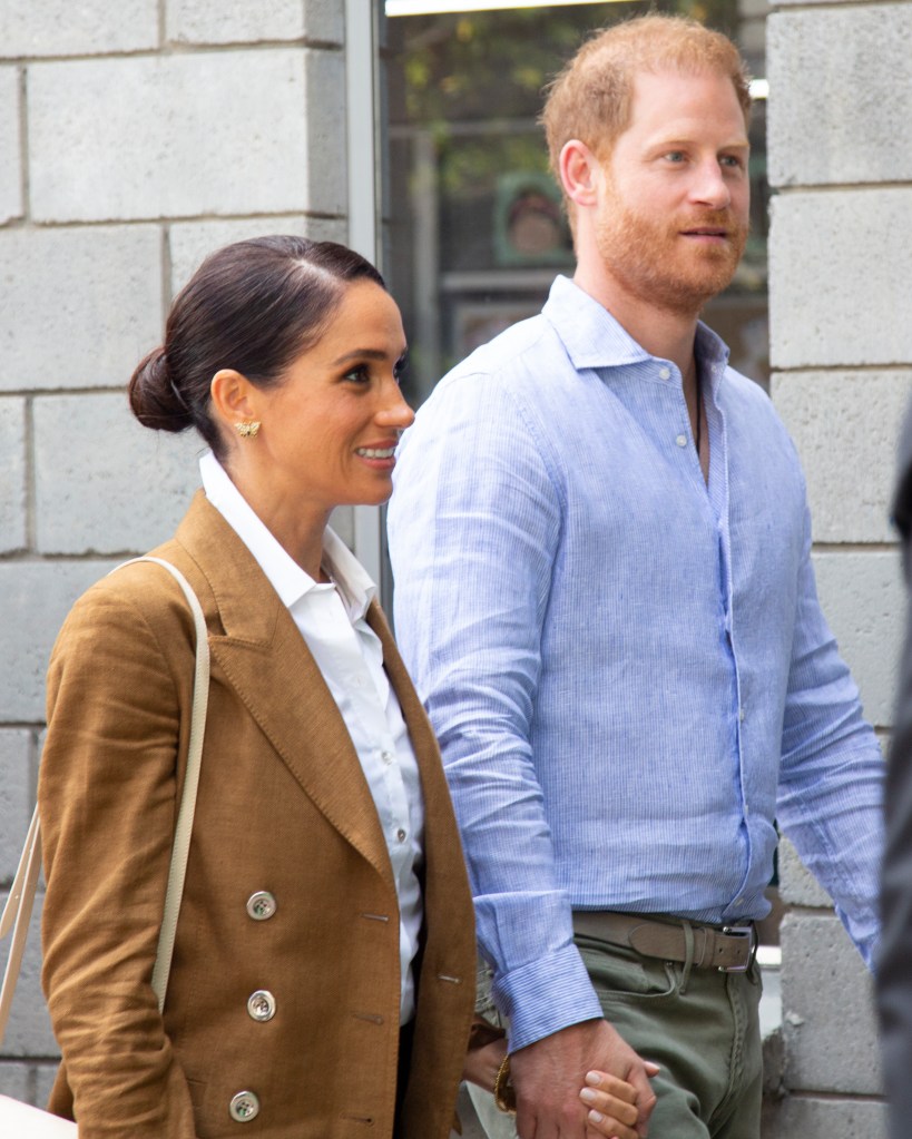 Meghan Markle wearing butterfly earrings that belonged to Princess Diana