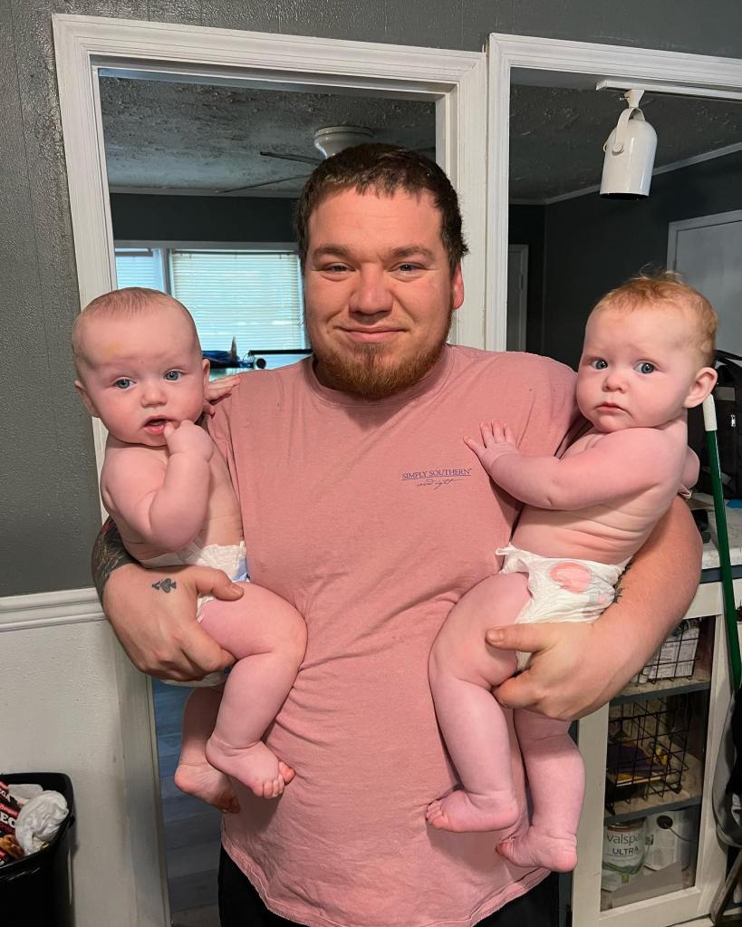 Josh Efird holding his twins.