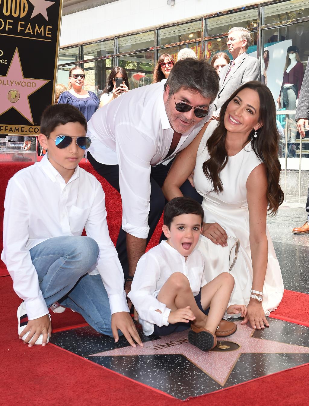 Simon Cowell, Lauren Silverman, Eric Cowell and Adam Silverman attend the ceremony honoring Simon with star on the Hollywood Walk of Fame on August 22, 2018 in Hollywood.