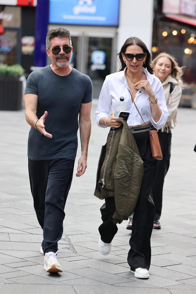 Simon Cowell and Lauren Silverman leaving Capital Breakfast at Global Radio Studios on June 05, 2024 in London, England.