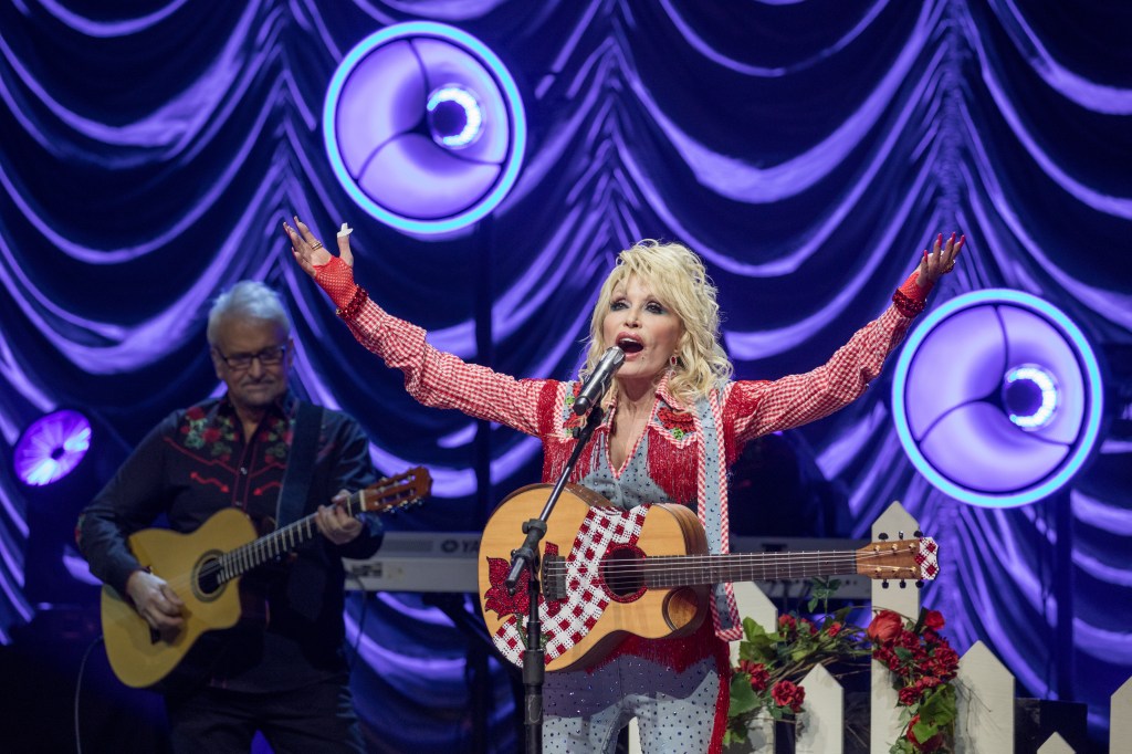 Dolly Parton performs onstage in March 2022