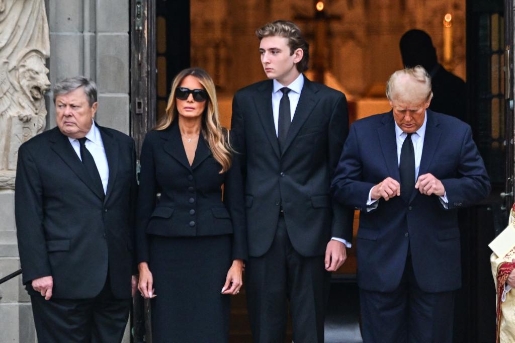 Former US President Donald Trump (R) stands with his wife Melania Trump (2L) their son Barron Trump (C) and father-in-law Viktor Knavs,