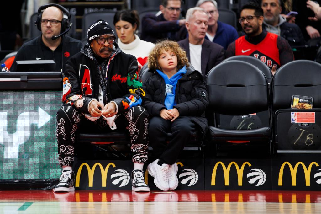 Dennis Graham and Adonis Graham at a basketball game in January 2024