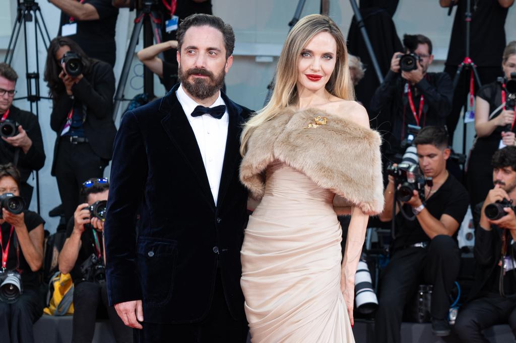 Jolie and director Pablo Larraín on the red carpet 