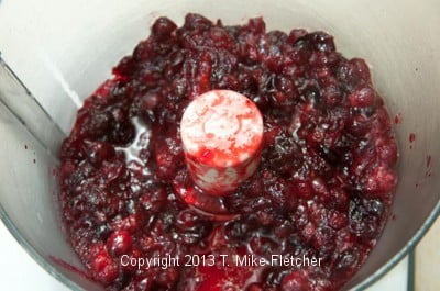 Cooked cranberries in processor