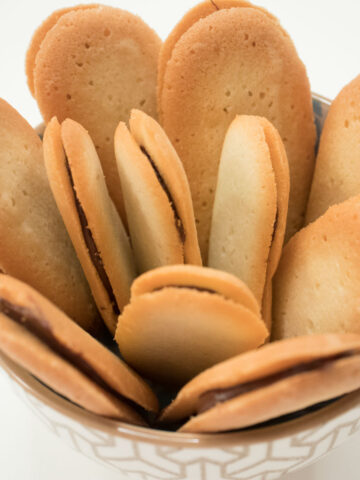 Langue de Chat cookies in a bowl.