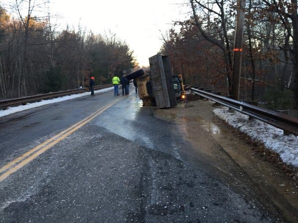 Water Main Break Topples Tractor, Closes Road