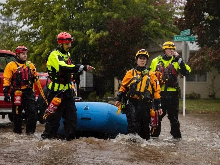 Firefighters in Santa Rosa, California, check for residents trapped by floodwaters on Neotomas Avenue in Santa Rosa on Sunday.
