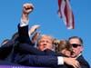 Republican presidential candidate former President Donald Trump is surrounded by U.S. Secret Service agents at a campaign rally, Saturday, July 13, 2024, in Butler, Pa.