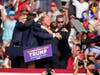 Republican presidential candidate former President Donald Trump is helped off the stage after being shot at a campaign rally in Butler, Pa.