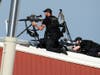 Police snipers return fire after shots were fired while Republican presidential candidate former President Donald Trump was speaking at a campaign event in Butler, Pa.