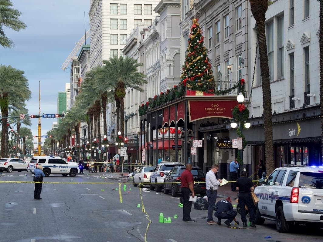 New Orleans police investigate the scene of a shooting Sunday, Dec. 1, 2019, on the edge of the city's famed French Quarter.