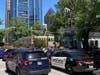 Emergency vehicles arrive on West Peachtree in Atlanta on Wednesday, May 3, 2023. Police say are investigating an “active shooter situation” in a building in Atlanta's Midtown neighborhood and that multiple people had been injured.