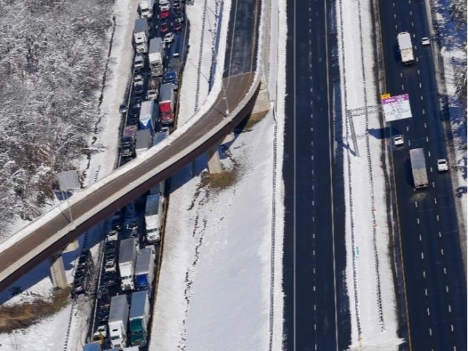 Cars and trucks are stranded on sections of Interstate 95 on Tuesday near Quantico, Virginia. Nearly 48 miles of the interstate were closed due to ice and snow.