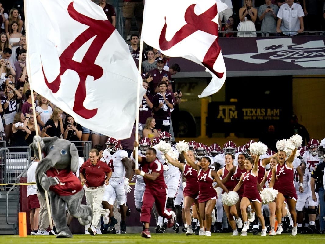 Alabama head coach Nick Saban leads his team on to Kyle Field before the start of an NCAA college football against Texas A&M on Saturday, Oct. 9, 2021, in College Station, Texas. 