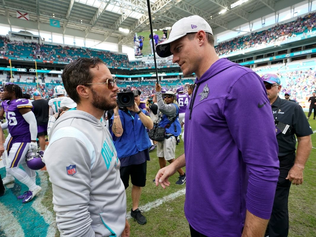 Minnesota Vikings head coach Kevin O'Connell, right, talks with Miami Dolphins head coach Mike McDaniel at the end of an NFL football game, Sunday, Oct. 16, 2022, in Miami Gardens, Fla.