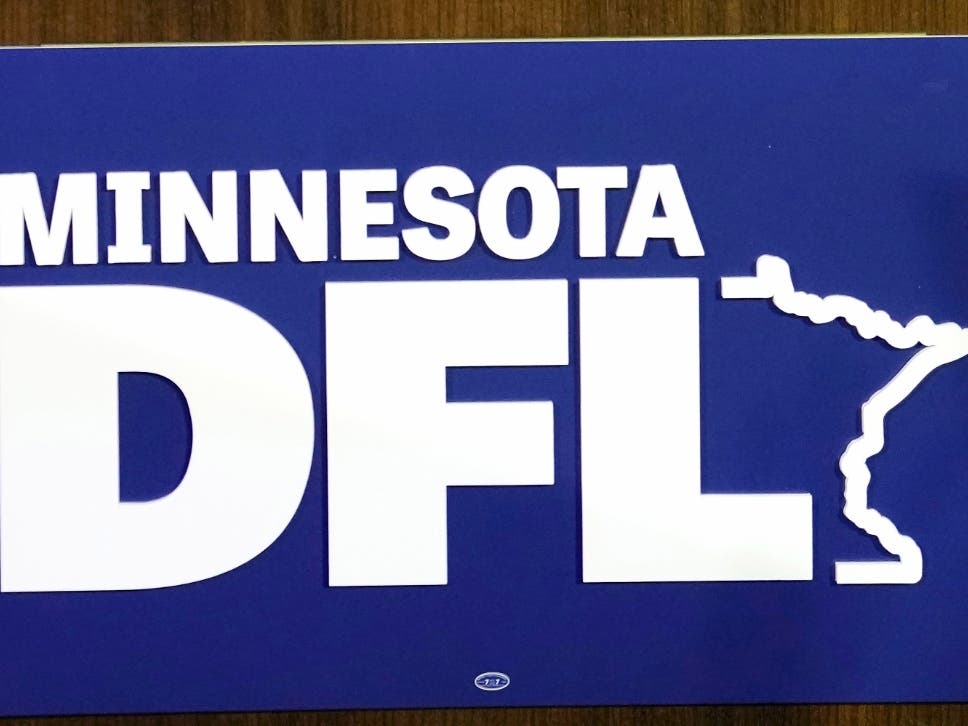 The Minnesota DFL logo appears on a podium at a DFL election-night party, Nov. 8, 2022, in St. Paul, Minn.