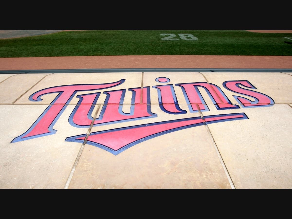 The Twins' logo is displayed on the Twins dugout at Target Field before a baseball game, between the Minnesota Twins and the Detroit Tigers, Sunday, July 24, 2011, in Minneapolis.