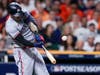 Minnesota Twins' Carlos Correa hits RBI-double against the Houston Astros during the first inning in Game 2 of an American League Division Series baseball game in Houston, Sunday, Oct. 8, 2023.