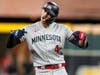 Minnesota Twins' Carlos Correa celebrates after a RBI-double against the Houston Astros during the first inning in Game 2 of an American League Division Series baseball game in Houston, Sunday, Oct. 8, 2023. 