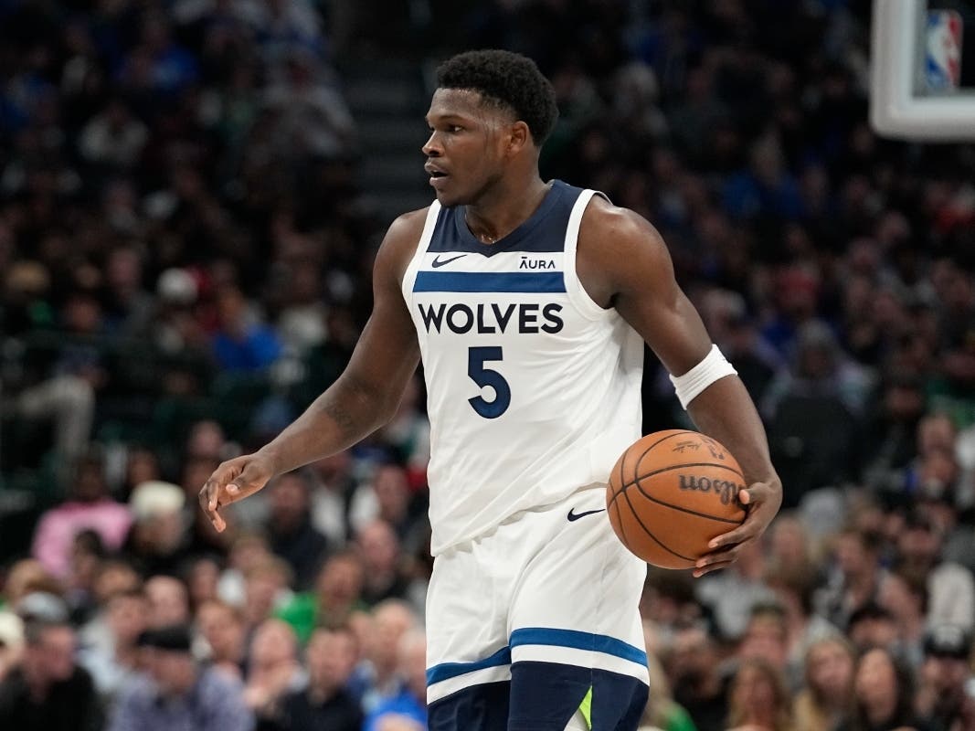 Minnesota Timberwolves guard Anthony Edwards dribbles during the second half of an NBA basketball game against the Dallas Mavericks in Dallas, Thursday, Dec. 14, 2023.