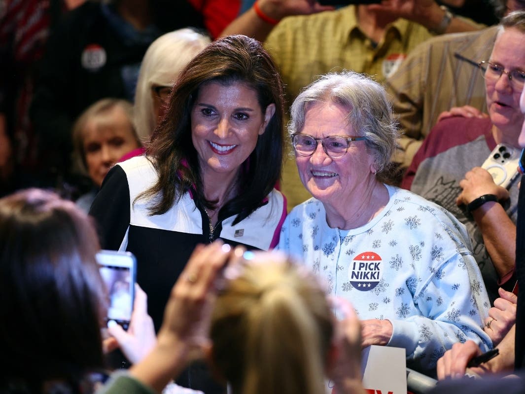 Republican presidential candidate former UN Ambassador Nikki Haley poses with supporters at a campaign event, on Feb. 26, 2024, in Bloomington, Minn.