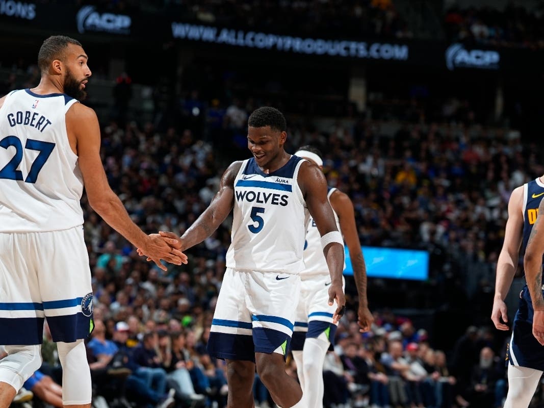 Minnesota Timberwolves center Rudy Gobert (27) and Minnesota Timberwolves guard Anthony Edwards (5) in the second half of an NBA basketball game Wednesday, April 10, 2024, in Denver.