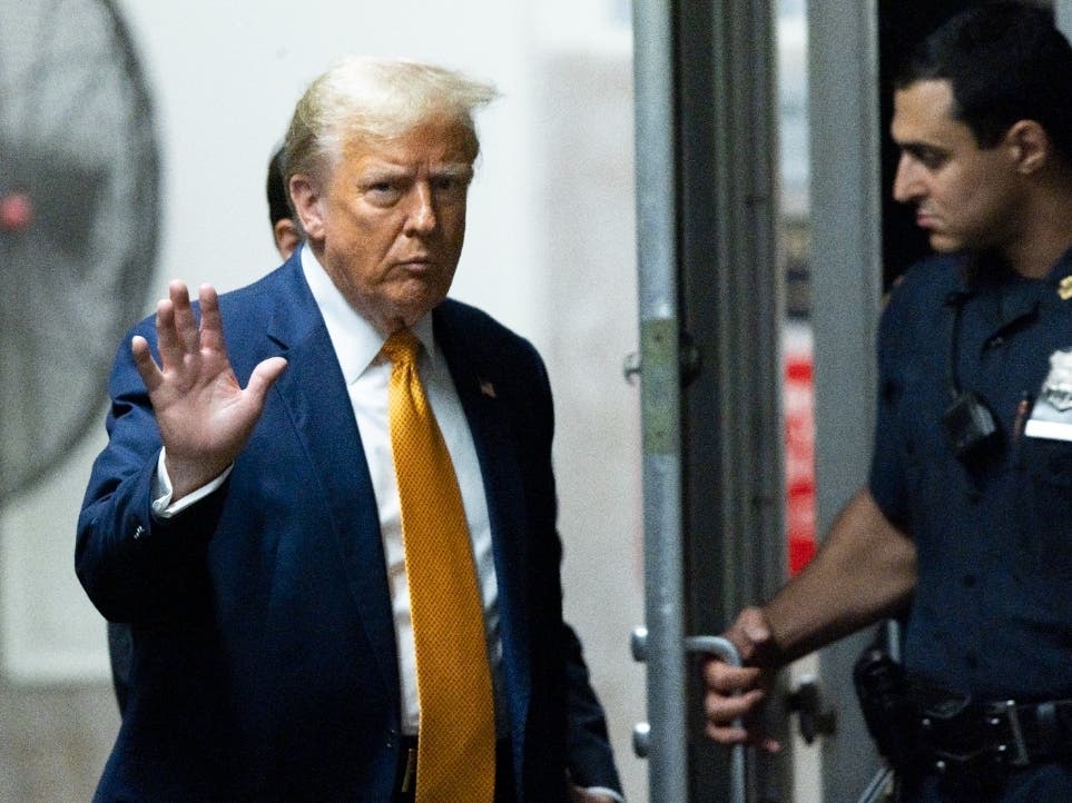 Former President Donald Trump returns to the courtroom after a break in his criminal trial at Manhattan Criminal Court before his trial in New York, Tuesday, May 14, 2024.