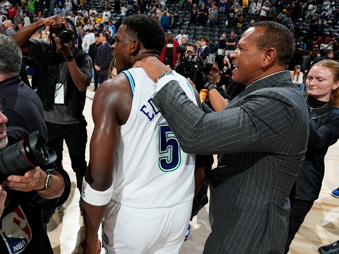 Minnesota Timberwolves guard Anthony Edwards, left, is congratulated by team minority owner Alex Rodriguez after Game 7 of an NBA second-round playoff series against the Denver Nuggets Sunday, May 19, 2024, in Denver.