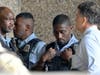 Members of law enforcement gather outside Hennepin County Medical Center in Minneapolis, Thursday, May 30, 2024, following a fatal shooting.