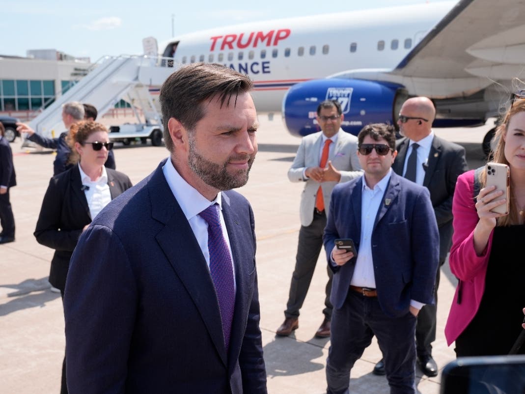 Republican vice presidential nominee Sen. JD Vance, R-Ohio, talks to reporters after walking over from looking at Air Force Two, Vice President Kamala Harris' plane, at Chippewa Valley Regional Airport, Wednesday, Aug. 7, 2024, in Eau Claire, Wis.