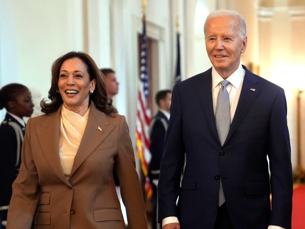 Vice President Kamala Harris, left, and President Joe Biden arrive for an event in the East Room of the White House, May 9, 2024, in Washington. 