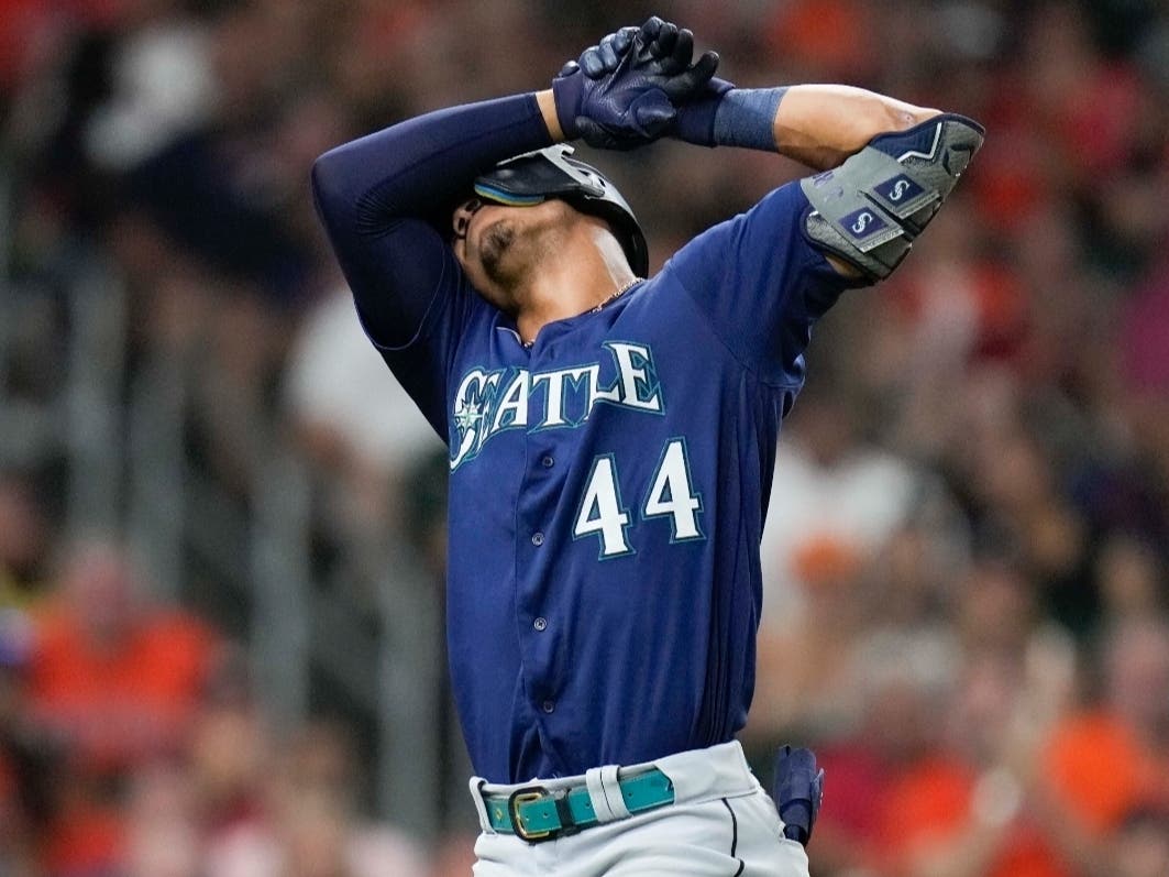 Seattle Mariners' Julio Rodriguez reacts after striking out during the eighth inning of the team's baseball game against the Houston Astros, Saturday, July 30, 2022, in Houston.