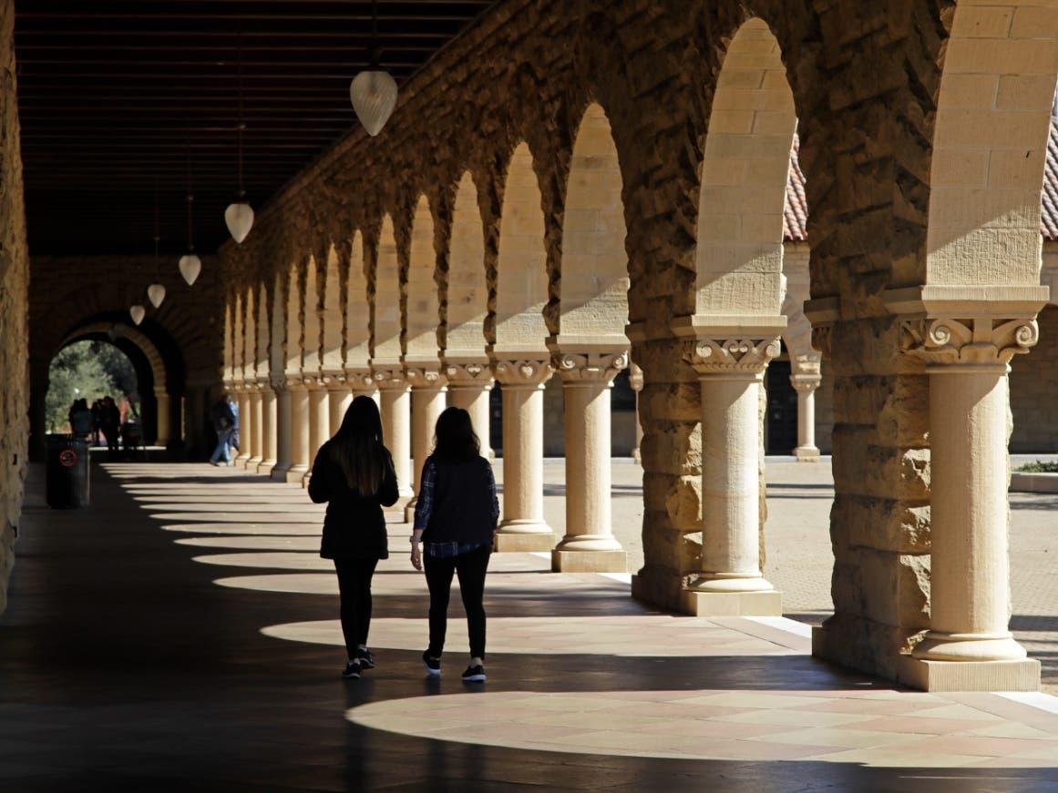 In this March 14, 2019, file photo students walk on the Stanford University campus in Santa Clara, Calif. A new study from the State Department and the Institute of International Education finds that international students in the U.S. grew by 12%.