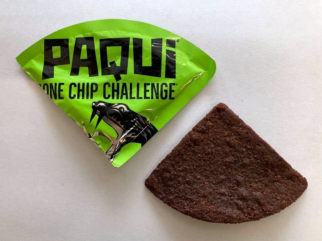 A Paqui One Chip Challenge chip is displayed in Boston, Friday, Sept. 8, 2023. A lawsuit was filed against a Thursday, July 11, 2024 in the case of a Massachusetts teen who died after he participated in a spicy tortilla chip challenge on social media.