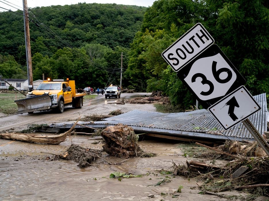 Debris from a building is seen along Route 36 in Canisteo, N.Y., on Friday after remnants of Tropical Storm Debby swept through the area.