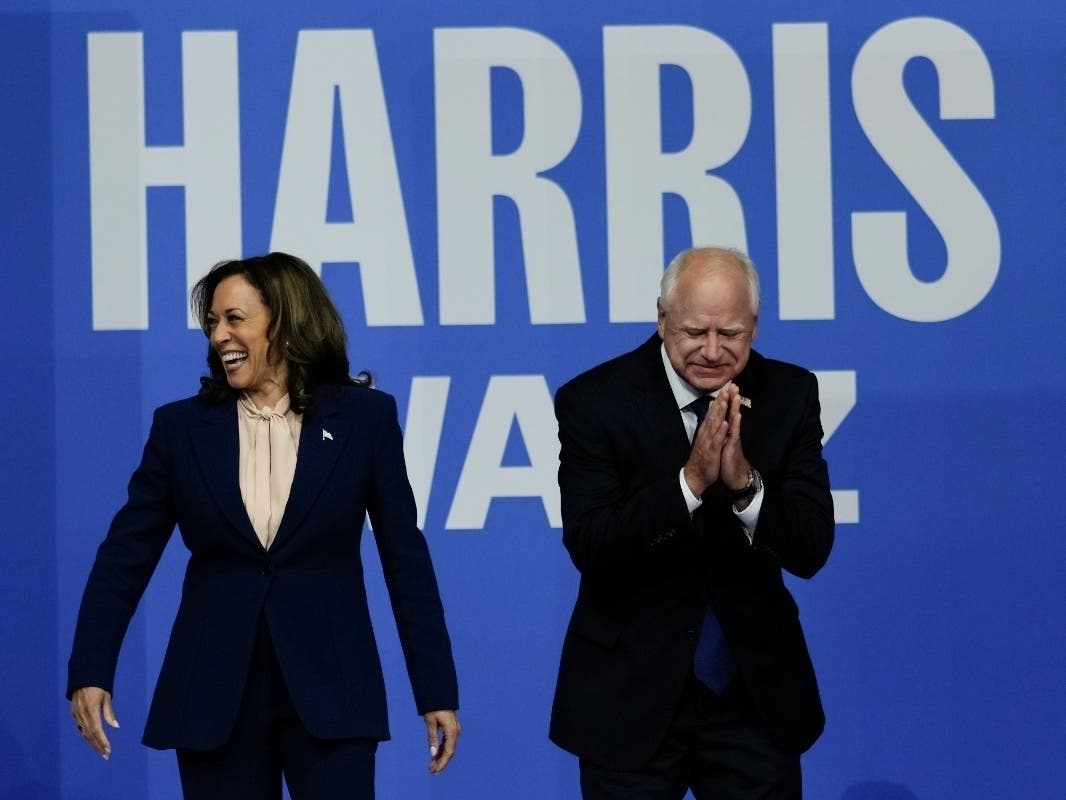 Democratic presidential nominee Vice President Kamala Harris and her running mate Minnesota Gov. Tim Walz arrive at a campaign rally in Philadelphia on Aug. 6, hours after she named Walz her running mate in the 2024 presidential election.