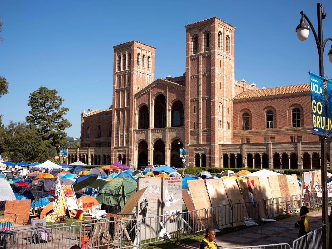 Pro-Palestinian protesters continued to occupy the grounds at University of California, Los Angeles in front of Royce Hall on Monday, April 29, 2024, in Los Angeles. Security has surrounded the encampment after a skirmish broke out Sunday.