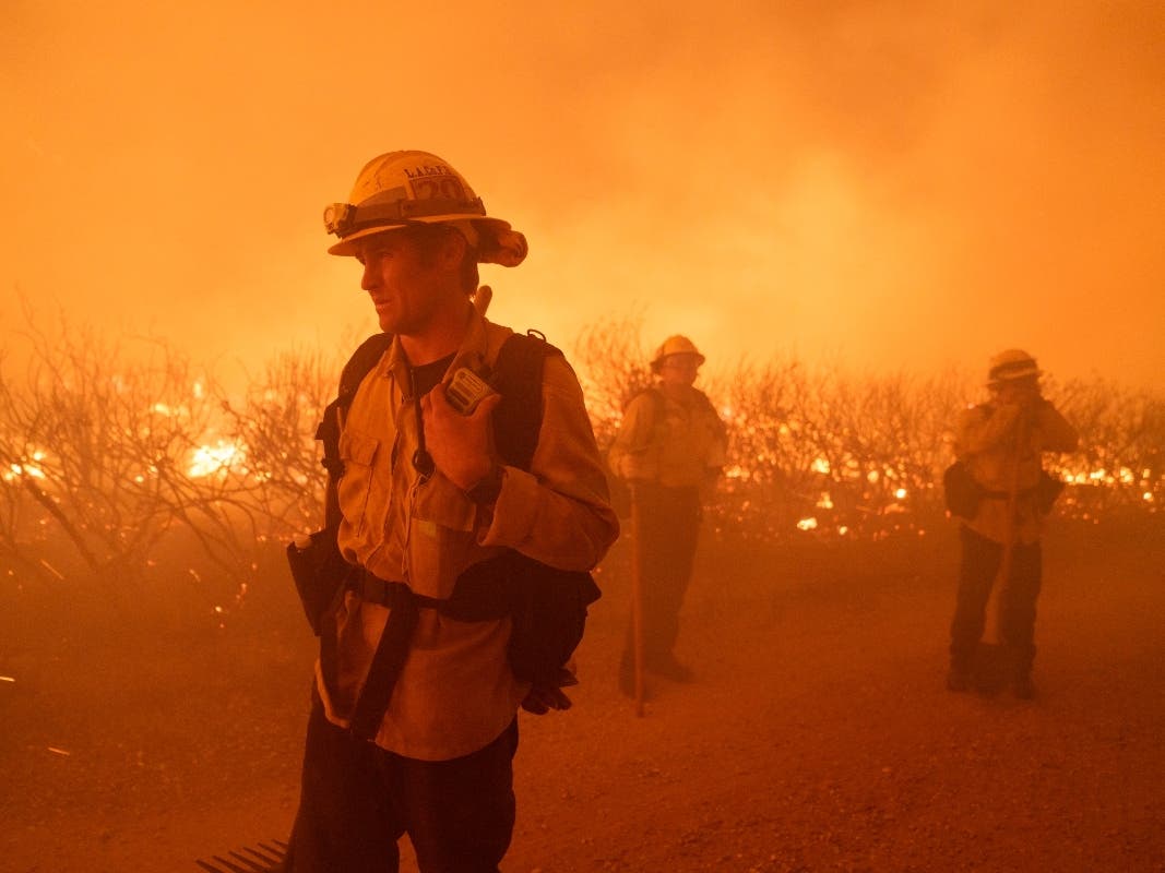 Firefighters work against the advancing Post Fire on Sunday, June 16, 2024, in Gorman, Calif. 